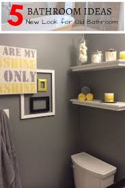 Dark grout enhances the patterned precision of the tiled floor, while crisp white woodwork and a pedestal sink balance the room¿s darker influences. Creative Small Bathroom Storage Ideas And Tips Bathroom Remodel Yellow Bathroom Decor Gray Bathroom Decor Yellow Bathrooms