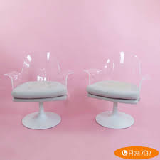 Vintage mid century modern oval glass top dining table with 4 lucite swivel dining chairs in amber color. Pair Of Mid Century Lucite Swivel Chairs Circa Who
