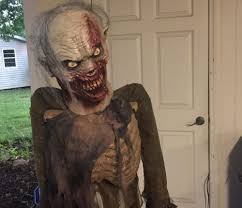 You could just buy decorations, but for something unique that you've built yourself, poormanprops has several ideas. Diy Animated Zombie Props Animatronichalloween Com