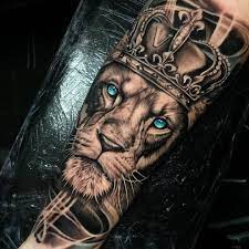 Brilliant collection of lion tattoo on hand with perfect designs. Art Amazing Blue Turquoise Eyes Lion Crown Tattoo By