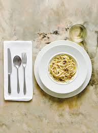 An empty table with no place setting is a clear indicator that the service will be casual. Set The Perfect Italian Dinner Table The Silver Spoon Way Food Phaidon