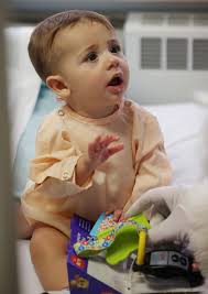 Photos: Santa and DFD visit MercyOne Genesis Pediatric and Birth Units