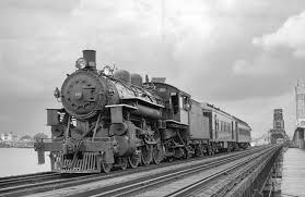 Florida East Coast 148 hauls a local train across the St. Johns River in  Jacksonville, August 1st 1932. The ALCO 4-6-2 now operates on the U.S.  Sugar Railroad. : rTrainPorn