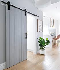 bunnings warehouse on instagram rustic charm barn doors are the answer to giving your home a subtle featur in 2021 home barn style sliding doors kitchen barn doors