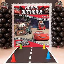 A disney cars birthday cupcake tower with 4 inch cutting cake. Disney Cars Party Ideas Party City