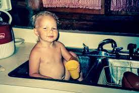 In infancy she was bathed in a baby bath tub. How To Wash A Kitchen Sink For Bath Time Practically Spotless