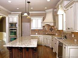 A backsplash with blue, turquoise, and seafoam green paired up with white cabinets will practically transport you to the beach. Antique White Kitchen Cabinets You Ll Love In 2021 Visualhunt