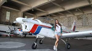 Download wallpaper Girl, Shorts, Mike, Jacket, Is, Sneakers, The plane,  Wheel, Connie Carter, section girls in resolution 1920x1080
