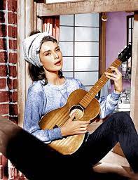 20 Best And 10 Worst Movie Theme Songs Audrey Hepburn Moon River Audrey Hepburn Hepburn