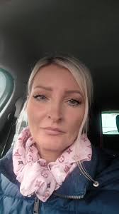 Person in Car with Distinctive Scarf and Jacket