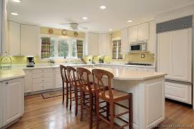 yellow kitchen white cabinets
