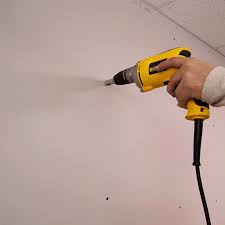 Drywall screws are more secure when installed properly, but drywall nails are much cheaper and, in certain areas, easier to put in. How To Hang Drywall