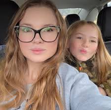 How do I know if my female kitten is in heat and when to get her spayed?