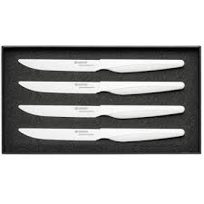 Table setting with steak knife. Kyocera Kyocera Ultra Sharp Lightweight Elegant Ceramic Steak Knives