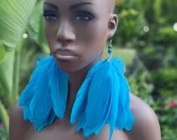 A Pair of Long Blue Feather Dangly Earrings.