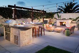 Bbq island outdoor kitchen light ideas. Backyard With Bbq Island And Outdoor Fireplace Hgtv