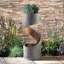 The sound of running water also creates the perfect calm it will add a modern edge to your patio or you could even nestle it amongst the flowers. Mains Powered Water Features Thompson Morgan