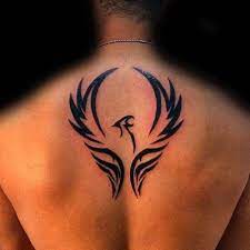 Phoenix designs are widely available in many colors. Man Back Tribal Phoenix Tattoo Erkek Sirt Anka Kusu Dovmesi Phoenix Wings Tattoo Tribal Phoenix Tattoo Back Tattoos For Guys