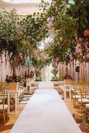 Indoor Luxury Wedding Ceremony Decor With Trees And White Aisle A Luxu Wedding Ceremony Decorations Indoor Luxury Wedding Venues Wedding Ceremony Decorations