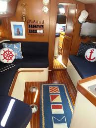 Signal Flag Rug With Navy Fabric And Nautical Icons And The Dhr Gimballed Lamp On The Wall Boat Interior Sailboat Decor Boat Interior Design