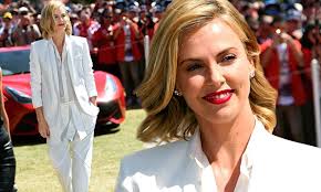 Charlize Theron is positively angelic as she steps out in bright white  ensemble at Melbourne Grand Prix