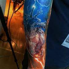 Some people use them as part of religious imagery. Very Realistic Looking Colored Heart With Lightning Tattoo On Arm Tattooimages Biz