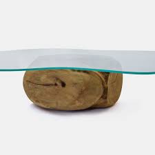 The extending leaves on the edges ensure that everyone can join in the fun. Organic Shape Glass Top Unique Mango Ball Coffee Table Rotsen Furniture