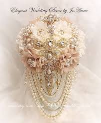 From dusty rose to cascading greenery, these bouquets burgeon with romance. Beige And Ivory Gold Jeweled Bouquet Draping Pearl Bouquet Brooch Bouquet Bouquet With All Gold Brooches Custom Bouquet Deposit