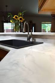 Countertop cost is determined by the price of the material and how much of it you'll need to cover your cabinets, island, vanities and similar surfaces. Get A Custom White Marble Look Out Of Your Kitchen Countertops Epoxy Countertop Bathroom Countertops Epoxy Countertop Cost Of Countertops
