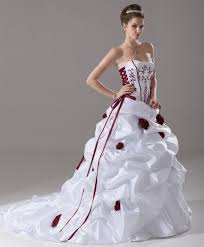 Bride in a luxurious wedding dress holding a wedding bouquet decorated with a black ribbon made of roses. Red And Silver Wedding Dresses Shop Clothing Shoes Online