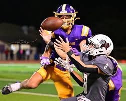 Capture of The Week This weeks capture of the week was "captured" during  our Friday night football game. I love this photo because you see the ball,  the offense and the defense