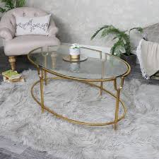 R & f staff feb 27, 2016. Large Gold Oval Glass Topped Coffee Table