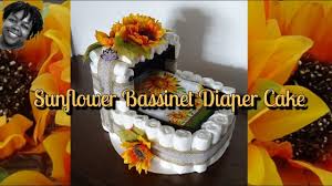 For a rustic or woodlands theme cake, decorate it with dollops of freshly whipped cream, berries a fun baby shower activity idea is to ask guests to write a message in a bottle. How To Sunflower Bassinet Diaper Cake Carriage Diaper Cake Baby Shower Centerpiece Youtube