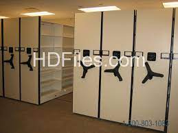 And now everyone can reach the shelves in your wall cabinet with our revolutionary chrome pull down shelving system. Moving File Cabinets And Filing Systems That Have Shelving That Slides On Rails In The Floor Innovative Storage Solutions