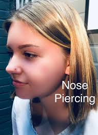 Fist of Needles Tattoo & Piercing