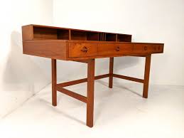 So i built him this desk with a flip up top and a pull out drawer that will hide the keyboard when he's not using it and it will open up when he's ready to practice. Danish Modern Teak Flip Top Desk By Peter Lovig Nielsen For Dansk Epoch