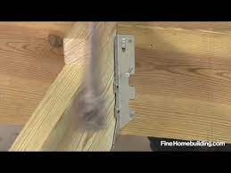 How To Install A Joist Hanger Youtube Joist Hangers Framing Construction Installation