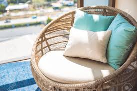 Outdoor wicker furniture is resilient and beautiful. Round Wicker Wood Chair With White Cushion And Comfort Pillows Stock Photo Picture And Royalty Free Image Image 100118276