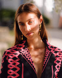 I do not love you as if you were salt-rose, or topaz or the arrow of  carnations the fire shoots off. I love you as certain dark things are to be  loved