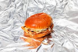 A charbroiled chicken breast, two strips of bacon, melted swiss cheese, lettuce, tomato and mayonnaise, served on a seeded bun. The Best Fast Food Grilled Chicken Sandwiches Ranked