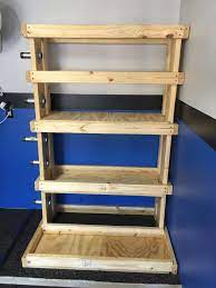 A pegboard or a bookshelf—you can create a variety of storage options for the individual items you have. Diy Gym Storage Rack Novocom Top