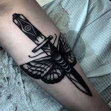 Death moth dagger tattoo