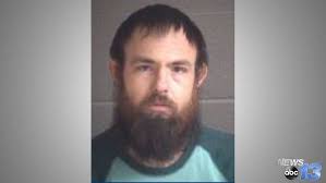 Buncombe County couple charged with abusing adopted child