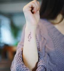Most people don't know the difference, but the bass clef looks like half a hear already. Tatto Wallpapers Treble Clef Tattoos