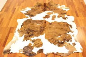 Fellteppich supernova kuhfell teppich teppich kuhfell rosdorf park handgefertigter shaggy teppich deacon aus kuhfell in Kuhfell Teppich Die Grosste Kuhfell Auswahl Deutschlands I Trendcarpet