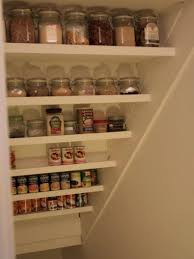 Under stairs pantry ikea shelves, rod and hooks. Under The Stairs Spice Rack Made Simply From Angled Shelves How To Use An Under The Stairs Storag Under Stairs Pantry Closet Under Stairs Understairs Storage