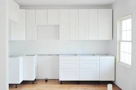 When determing how to install base cabinets on uneven floors, check for level and plumb, and add shims until the cabinets are at the same level. 14 Tips For Assembling And Installing Ikea Kitchen Cabinets