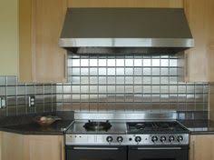 Options for decorative backsplash panels range from metal — like tin backsplashes — to glass tile and more, along with stunning patterns and colors to choose from. 20 Stainless Steel Tiles Ideas Stainless Steel Backsplash Backsplash Steel Backsplash