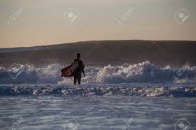 Surfer About To Paddle Out In High Surf Photographed In Rockaway