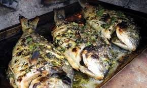 Whole Gilthead Bream With Lemon Garlic And Parsley Served With Caper Butter Fish Recipes Sea Bream Recipes Fish Dishes